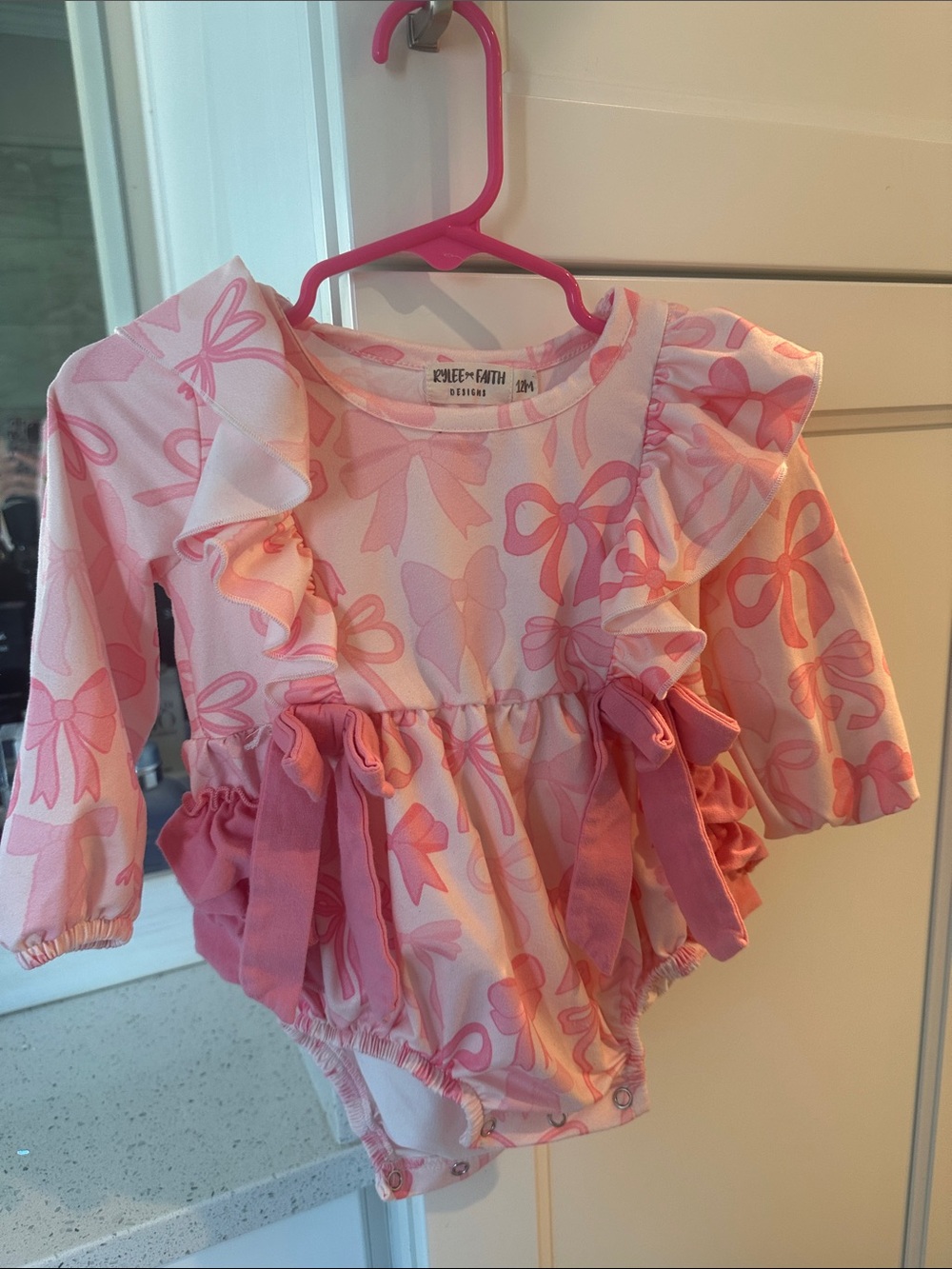 Ruffle-Front Pink Bow Print Baby romper Rylee + Faith